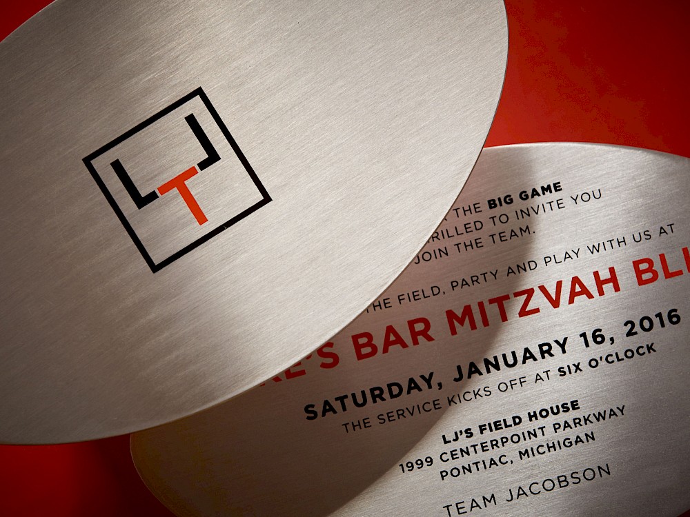 Invitation detail featuring event monogram (LTJ)