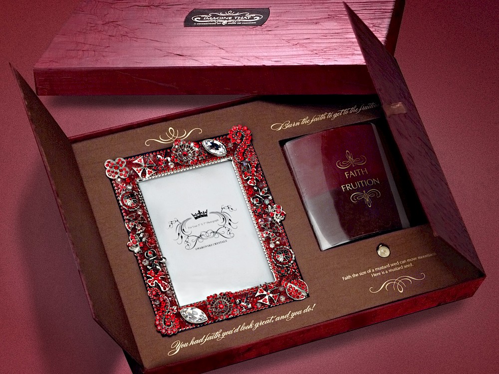 Guest gifts for Tyler Perry Studio's grand opening featuring custom 2-toned candle, bejeweled frame and mustard seed trinket