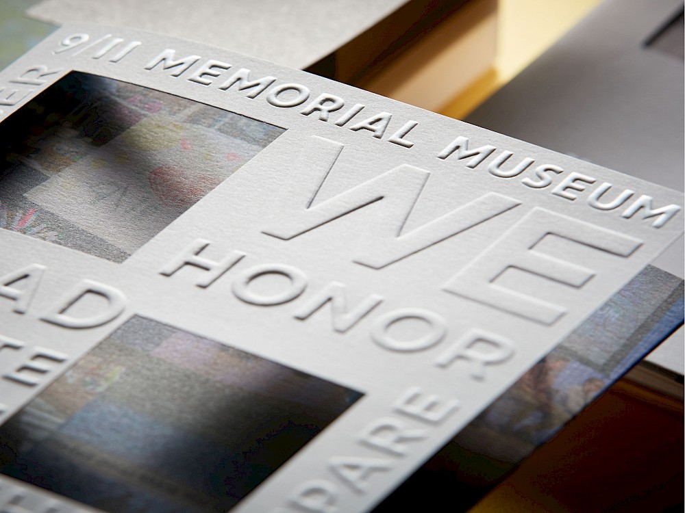 Invitation with embossing detail and die-cuts representing the footprint of the Twin Towers