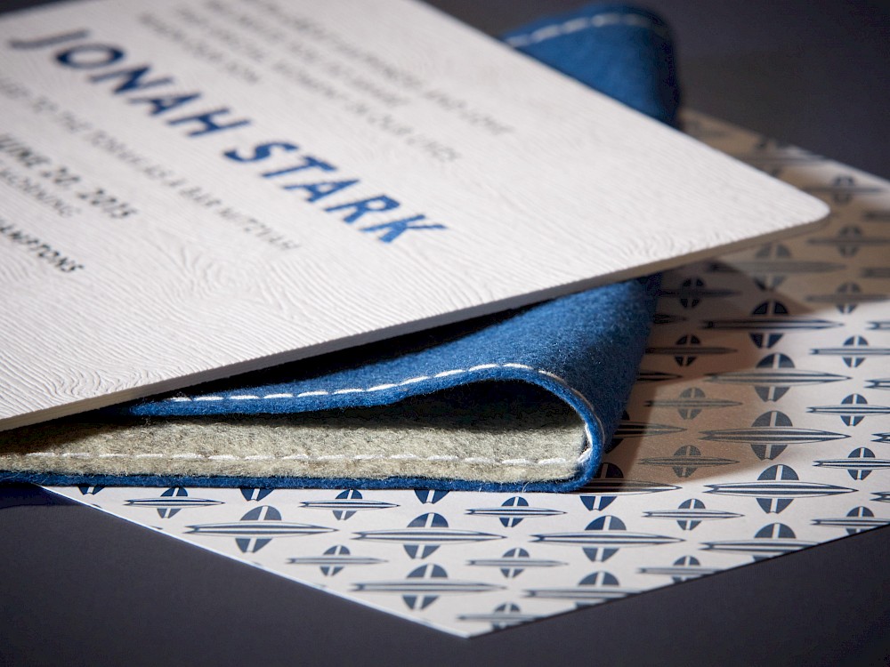 Hand-stiched, 100% wool felt envelope and thick wood grain embossed invitation