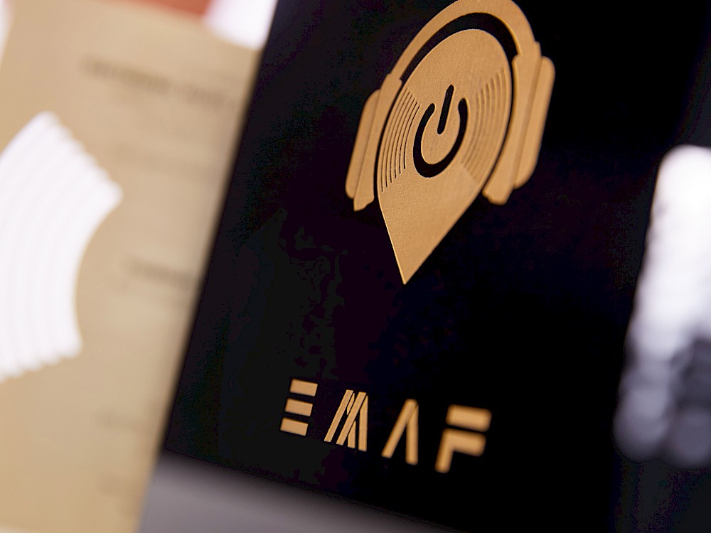 Event logo-etched and filled on invitation lid