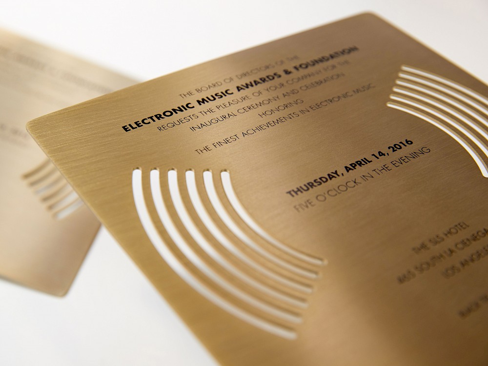 Brushed anodized aluminum and laser-cut invitation