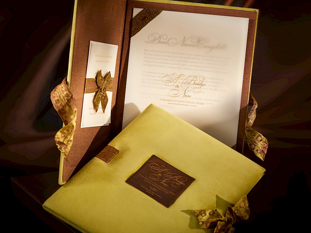 Suede wrapped, two-color hand-calligraphed invitation to honored Legends