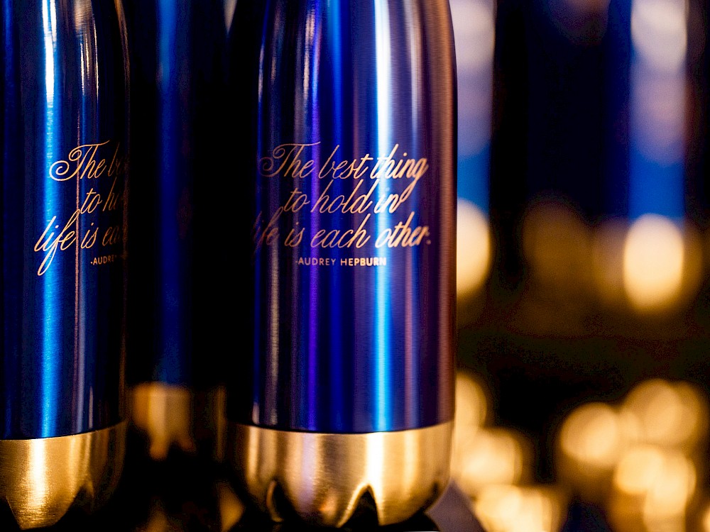 Individual guest champagne bottles inscribed with the couple's favorite movie quotes