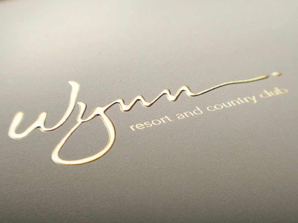 Foil and embossed logo treatment