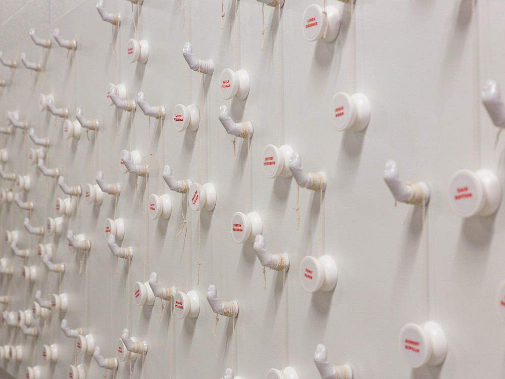 Table seating installation featuring personalized yo-yos with designated table icon